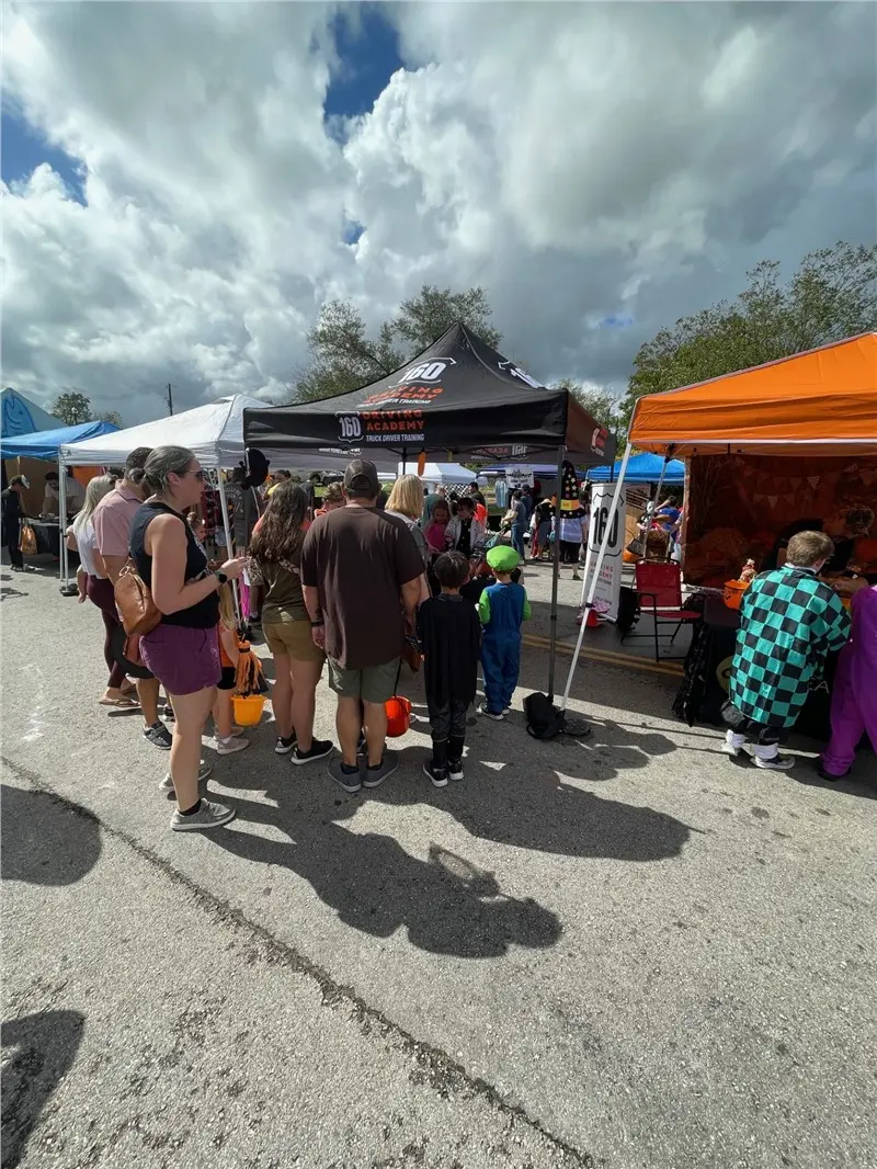 People attending Trick or Treat event at stalls