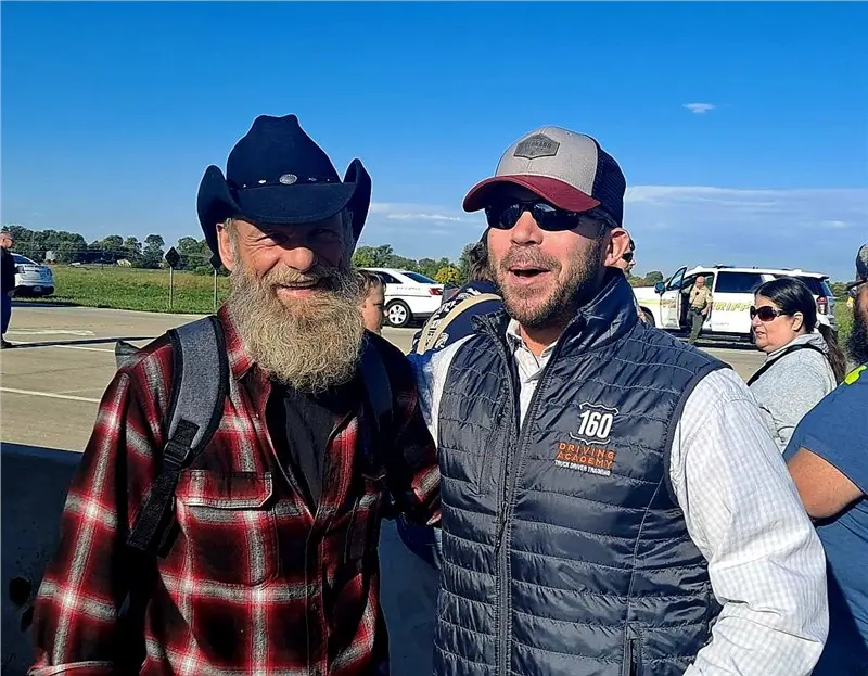 bearded men outdoors smiling