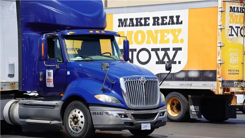 blue delivery truck parking