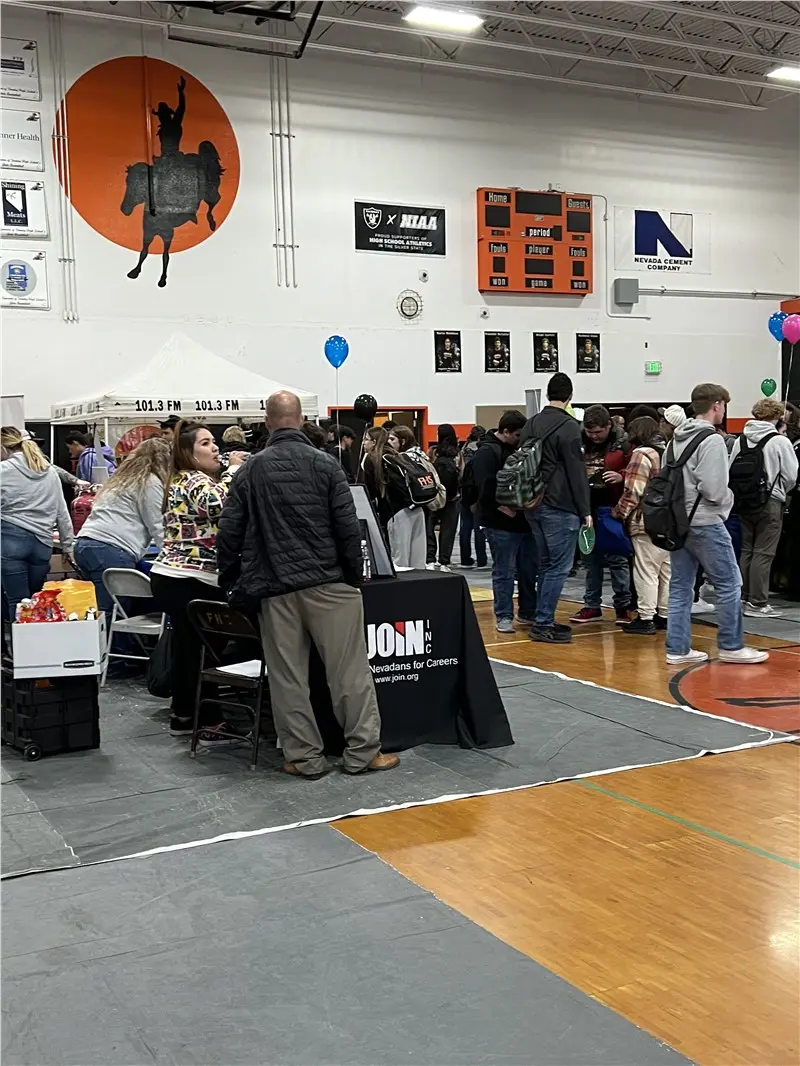 Team engaging students at the Fernley High School Career Fair