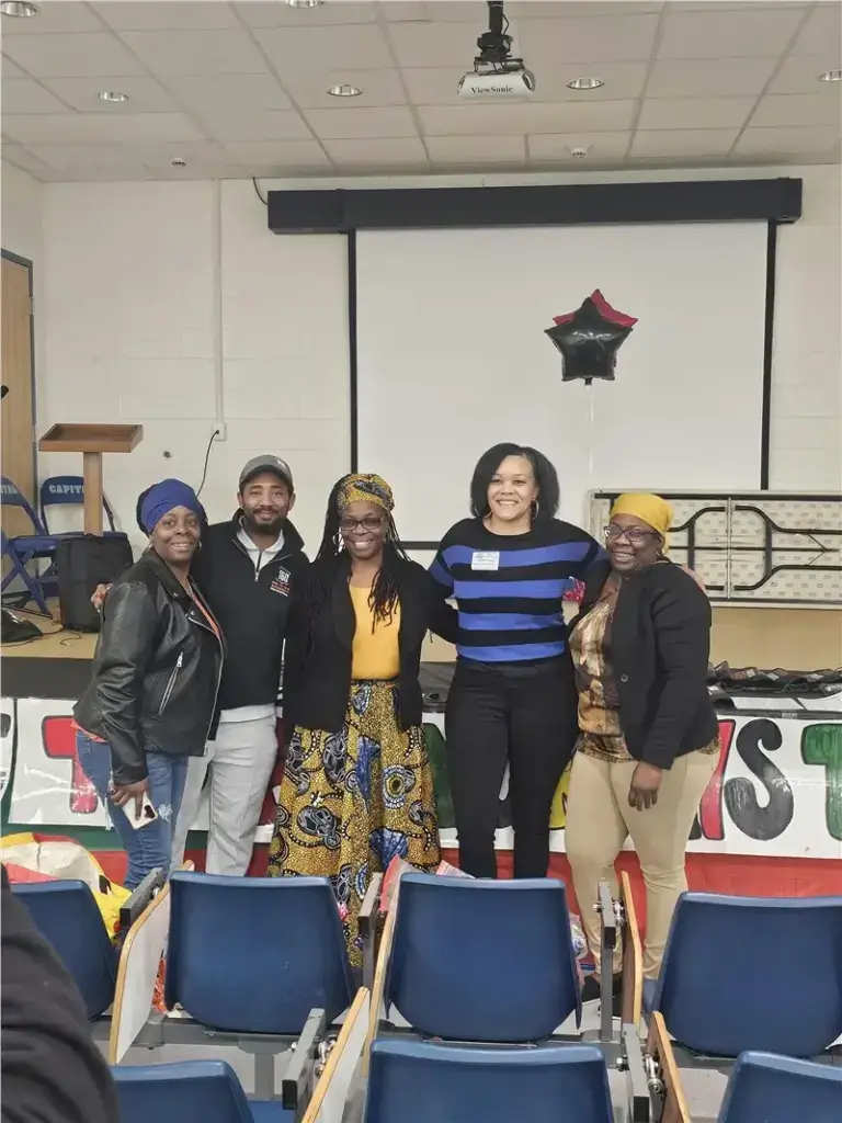Group of people smiling at community event