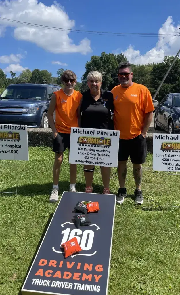 Cornhole Tournament Participants and Signage