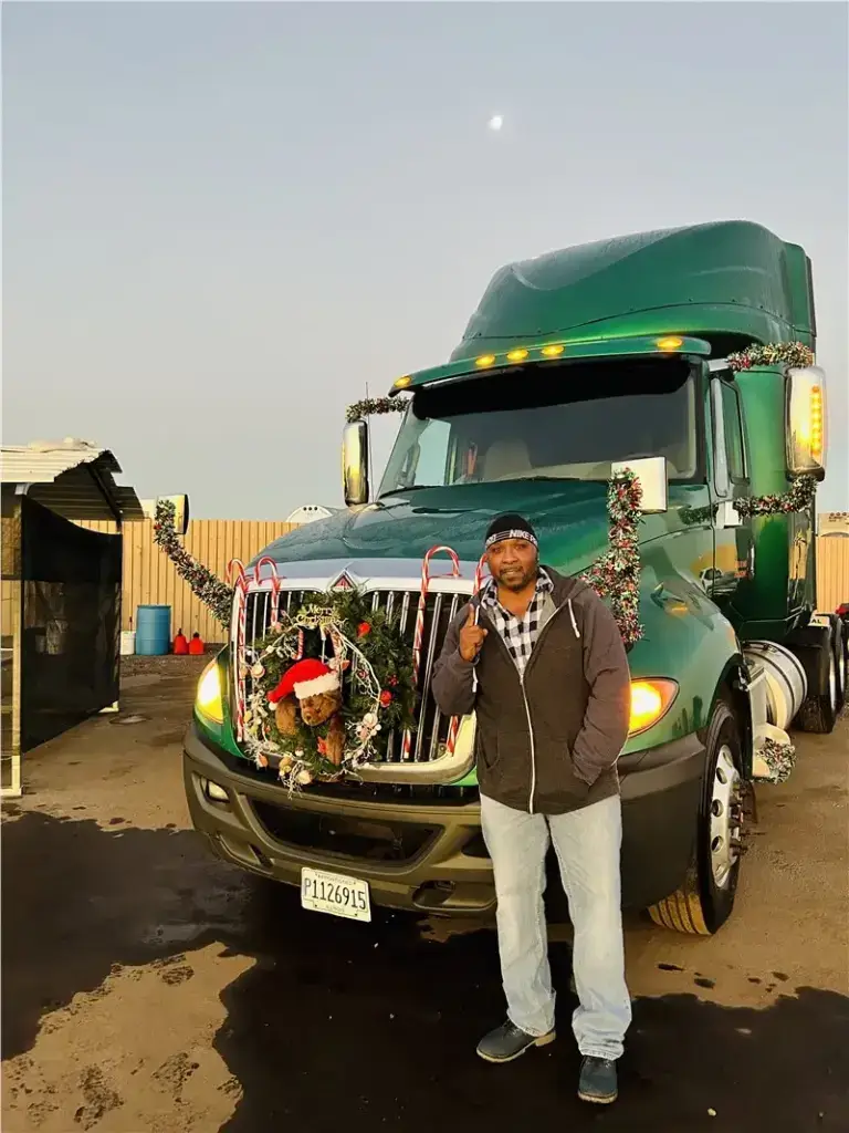 decorated green truck with driver
