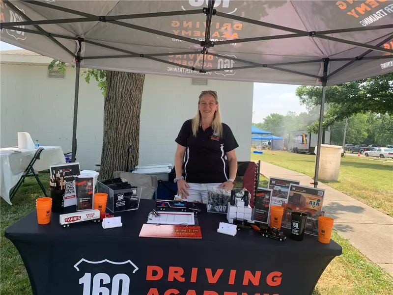 Driving Academy booth at outdoor event