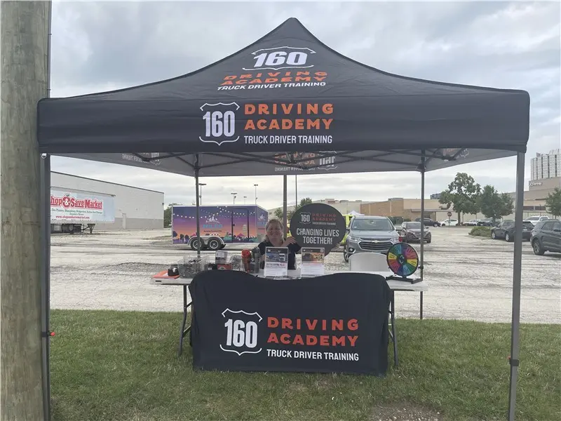 160 Driving Academy promotional event booth outdoors