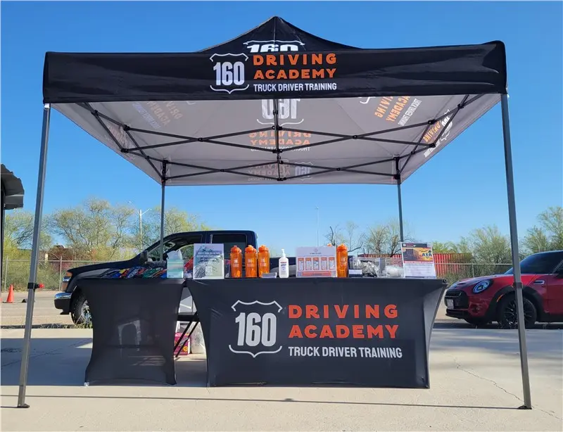 160 Driving Academy promotional booth setup outdoors