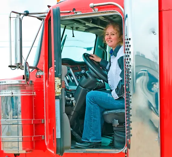 female truck driver in cab