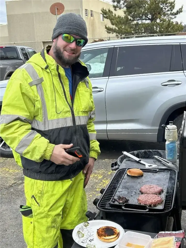 grilling hamburgers outdoor worker