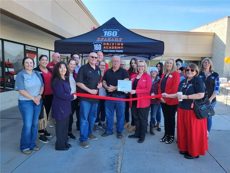 Group at 160 Driving Academy ribbon-cutting event