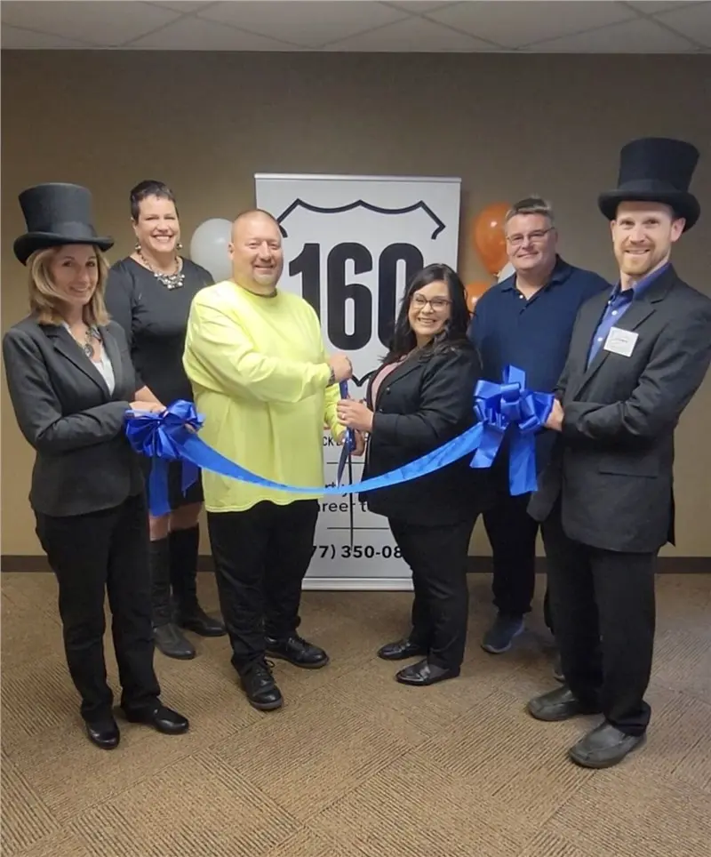 Group at 160 Driving Academy ribbon-cutting ceremony