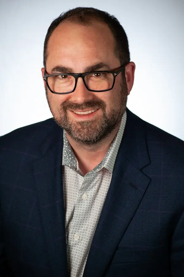 smiling man with glasses