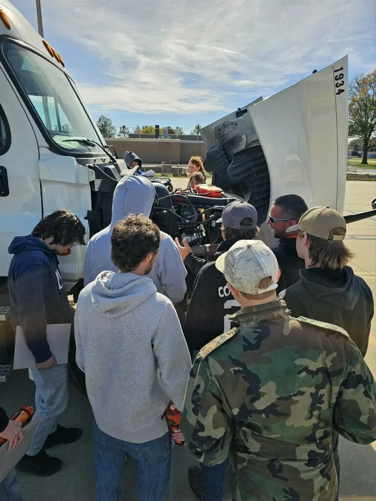 students learning about truck engine