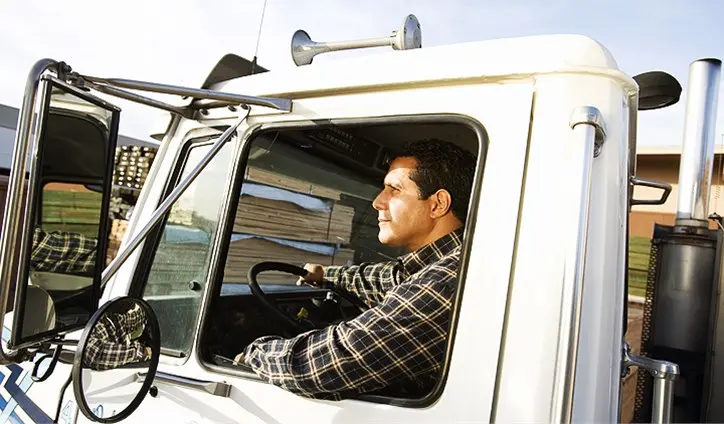 Man driving a large truck