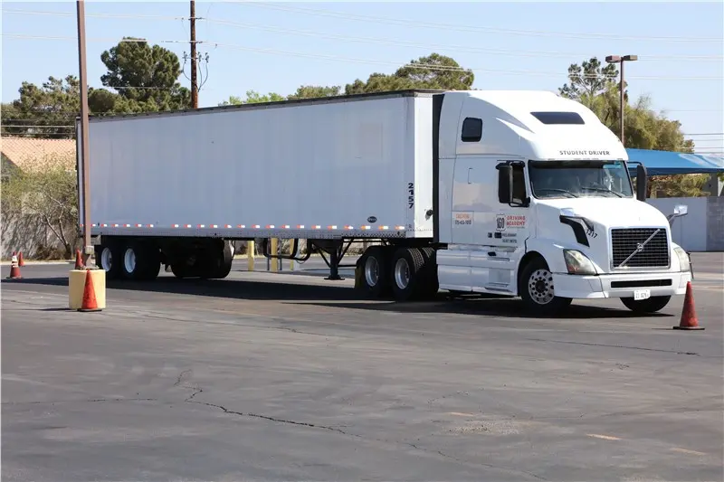 White semi truck maneuvering in a training area