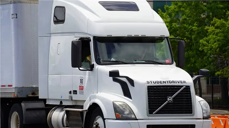 white semi truck driver