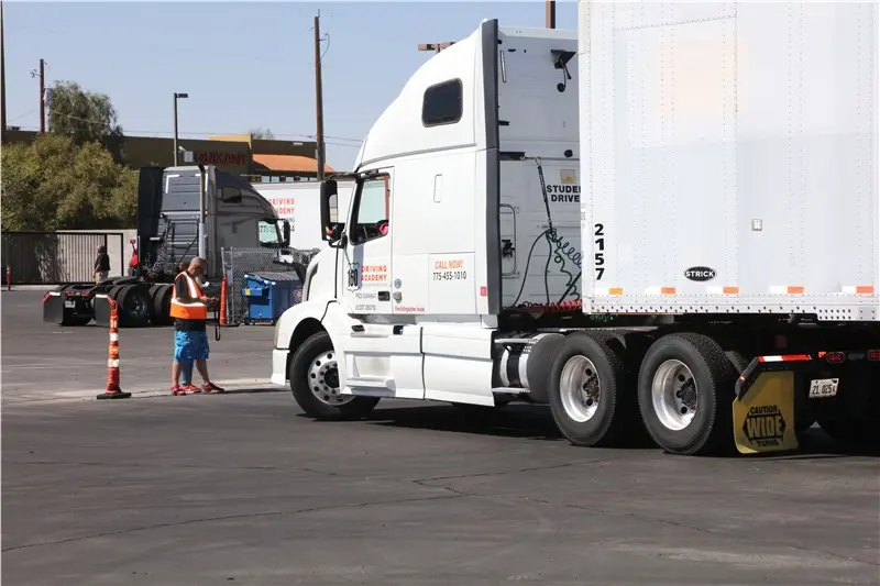 white semi truck parking lot