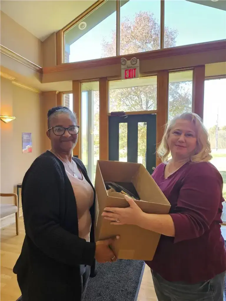 women holding box indoors